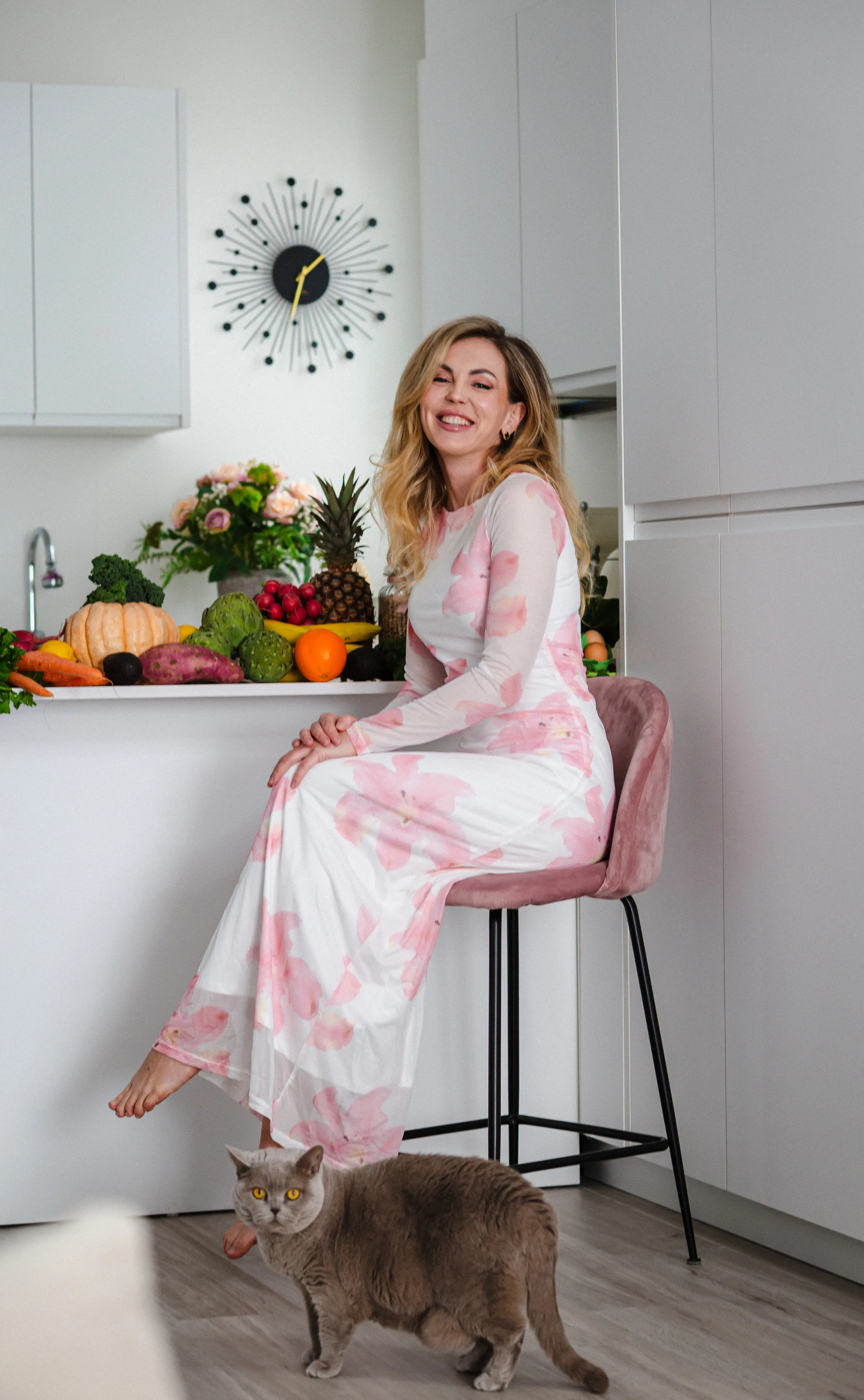 Valentyna smiling at a kitchen counter with fresh produce